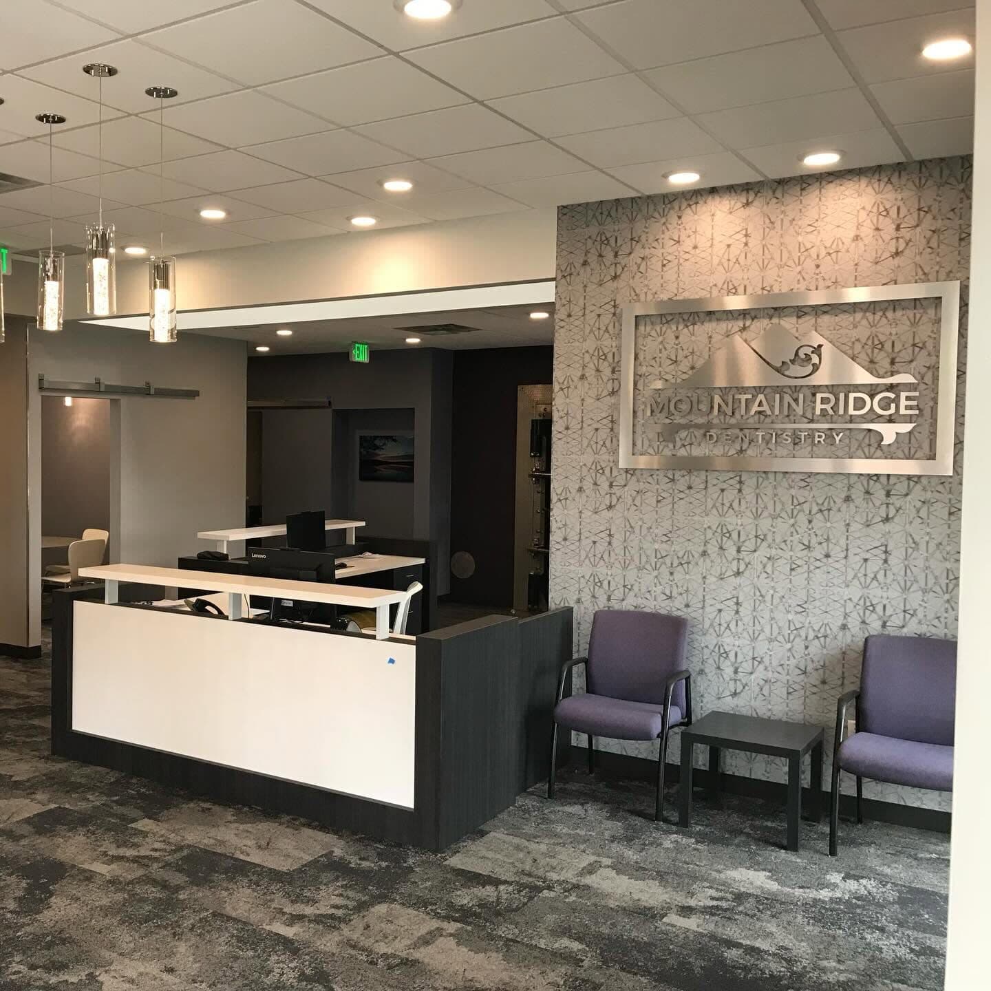 Mountain Ridge Dentistry reception with the branded stone accent wall